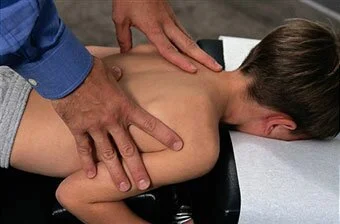 boy-getting-chiropractic-treatment